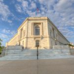 Entrance to the Russell Senate Office Building across from the U.S. Capitol on a beautiful, sunny day.
